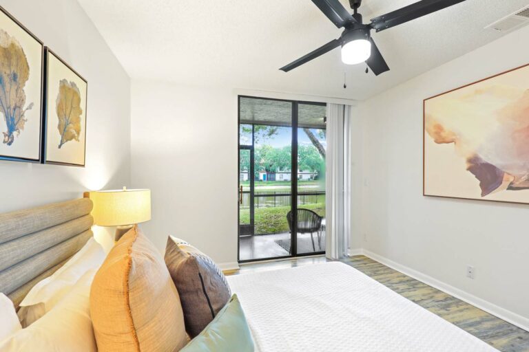 bedroom with ceiling fan and wood-style flooring